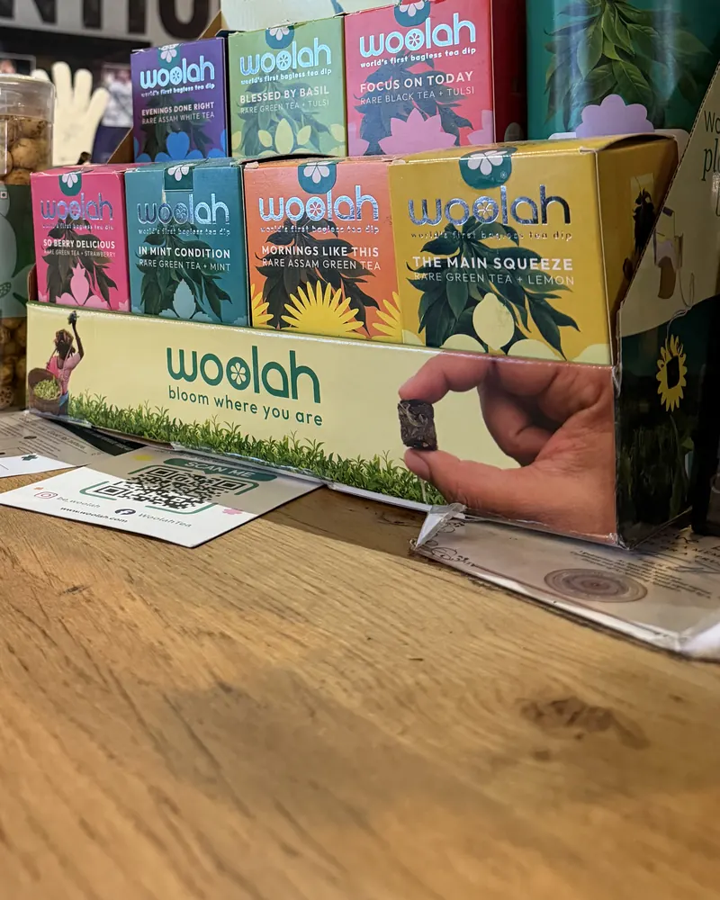 Woolah teas and Makhanza snacks on a bar counter